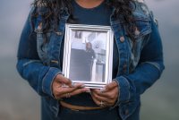 StéAira Ballard holds a framed photo of her mother, Tamala Smith.