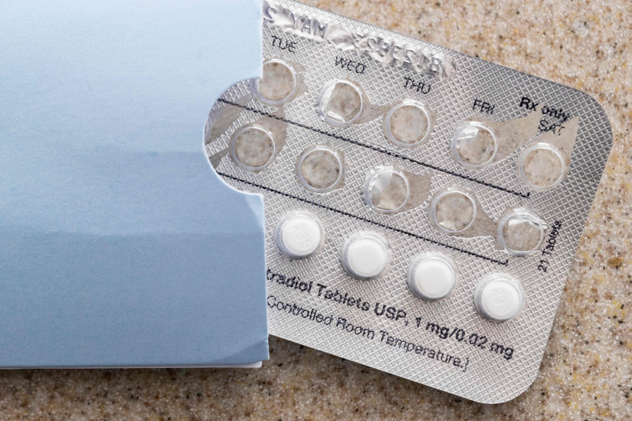 A partially used blister pack of pills is shown on a countertop