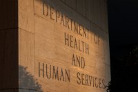 A sign is carved at the entrance to the Hubert H. Humphrey Building. It reads, "Department of Health and Human Services."